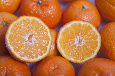 Sliced mandarines on mandarines.の写真素材