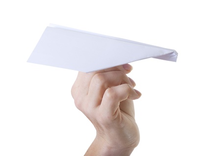 Paper plane in hand isolated on white.の写真素材