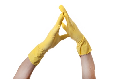 Yellow gloved  hands isolated on white.の写真素材