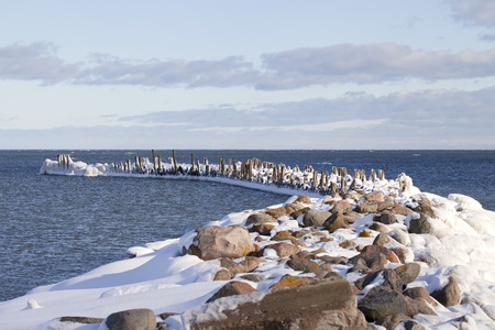 Breakwater in winter の写真素材