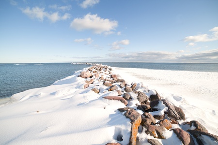 Breakwater in winter の写真素材