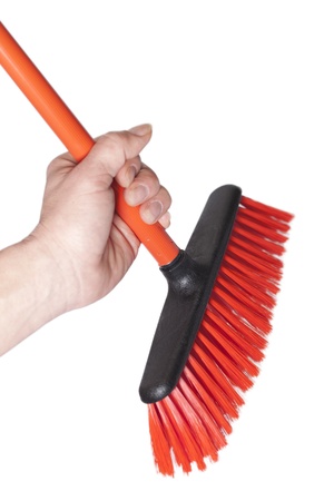 Hand and broom isolated on white  の写真素材