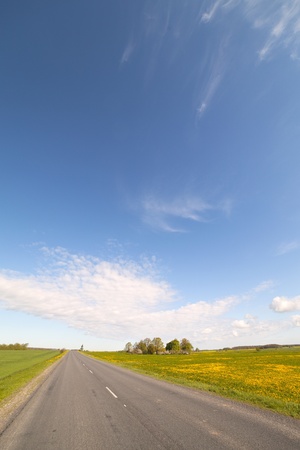 Road, field and sky の写真素材