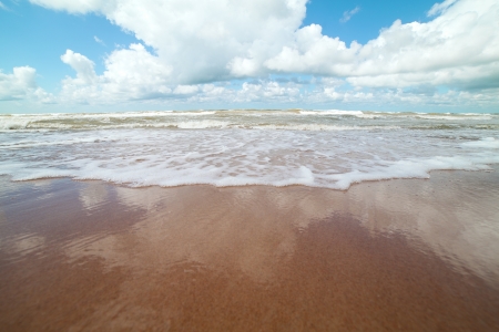 Waves on sand at Baltic  sea coast の写真素材