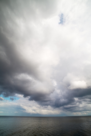 Big and dark cloud over sea の写真素材