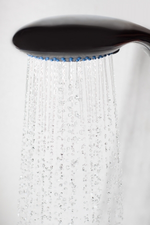 Shower head and and falling water drops の写真素材
