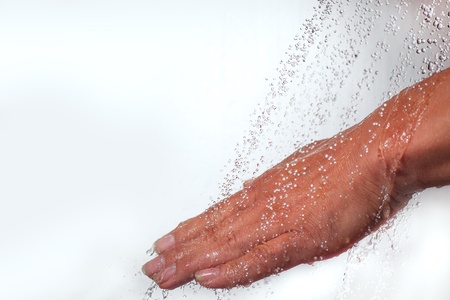 Human hand and faling water の写真素材