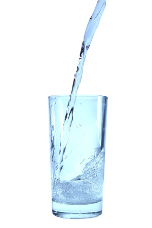 Glass of pouring water isolated on white の写真素材