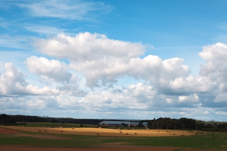 Cloud over land and fields の写真素材