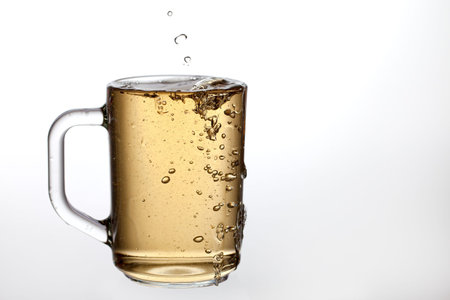 Pouring drink and transparent glass の写真素材