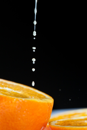 Ripe orange and juice drops の写真素材