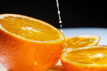 Ripe orange and juice drops の写真素材