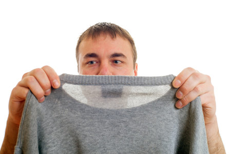 Young man and gray pullover on white の写真素材