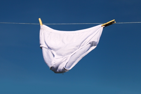 Underwear on clothesline in sunny day の写真素材