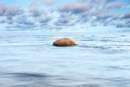 Brown stone in blue sea.の写真素材