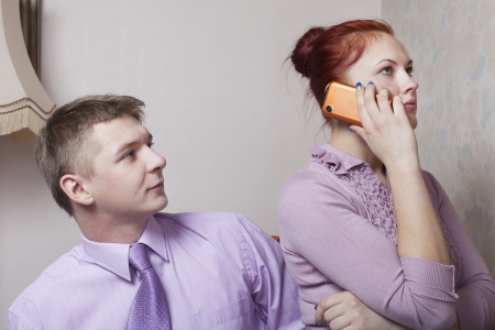Phone and young couple.の写真素材