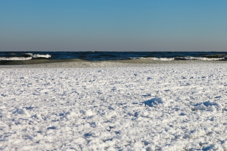 White ice of Baltic sea under clear and blue sky.の写真素材