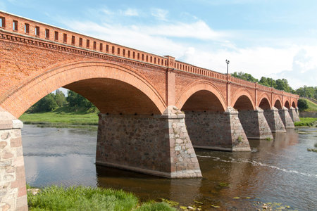 Brick bridge over Venta river in Kuldiga city, Latvia.の写真素材