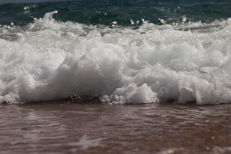 Nice wave on sandy beach.