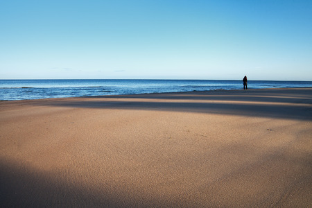 Sunlight and shadows on baltic sand.の写真素材