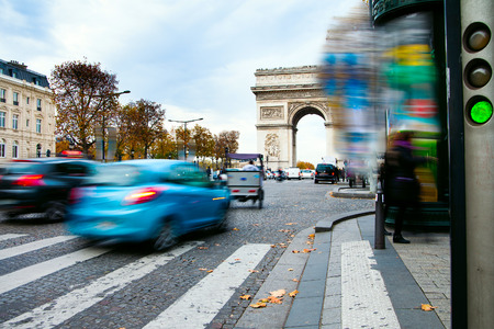 Traffic at Arc de Triomphe in Paris, France.の写真素材