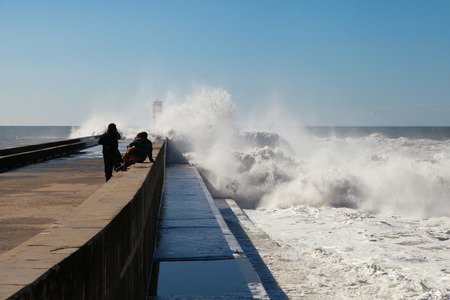 Atlantic waves splashing on Duoro river breakwater, Porto , Portugal.の写真素材