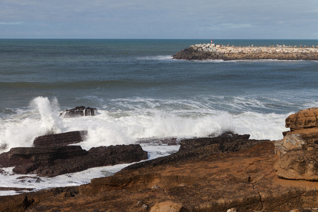 Atlantic ocean coast and breakwaterat Ericeira vilage, Portugal, Europe.の写真素材