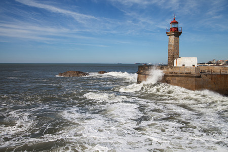 Atlantic waves on Douro river breakwater in Porto city, Portugal.の写真素材