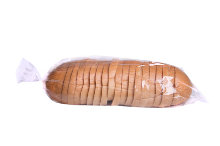 Sliced bread in plastic bag isolated on white.の写真素材