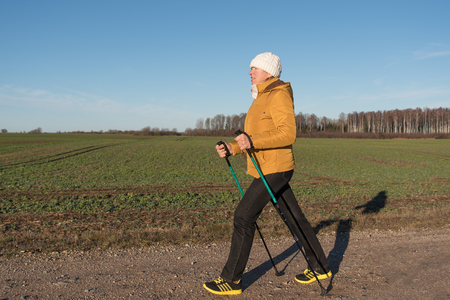 Nordic walking in nice autumn day.の写真素材
