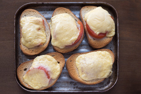 Fresh hot sanwiches with tomato and cheese.の写真素材