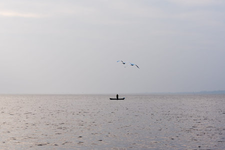 Angler in lake.の写真素材