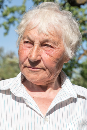 Senior woman in her garden.の写真素材