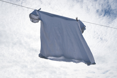 Wet shirt on clothesline.の写真素材