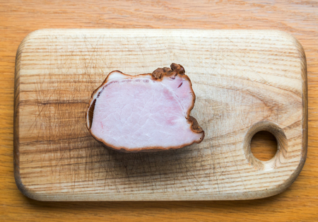 Smoked meat on cutting board.の写真素材