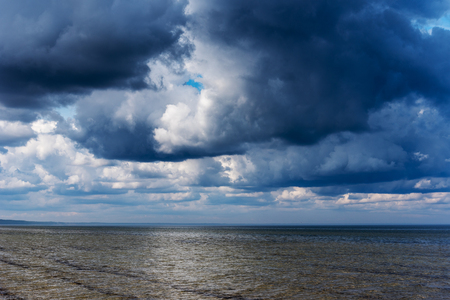Stormy clouds above Baltic sea.の写真素材