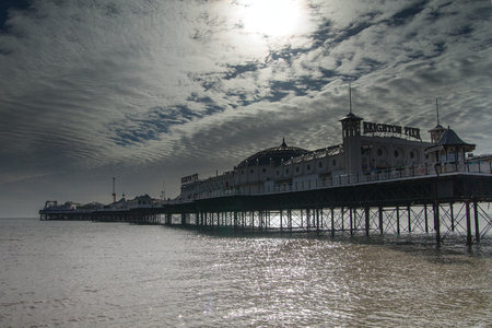 Brighton, UK - 5  March 2014 : Brighton pier warm up in spring sunlight.のeditorial素材