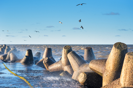 Baltic sea waves crashing against Liepaja port mole, Latvia.の写真素材