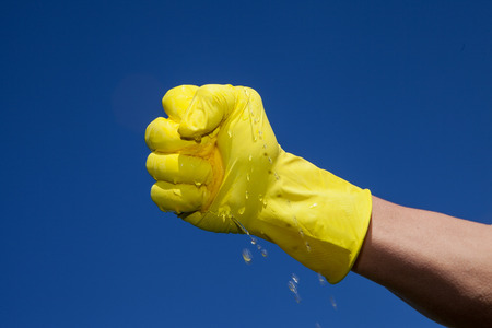 Wet cloth in hand.の写真素材
