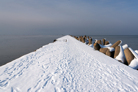 Icy breakwater in Liepaja port , Latvia.の写真素材