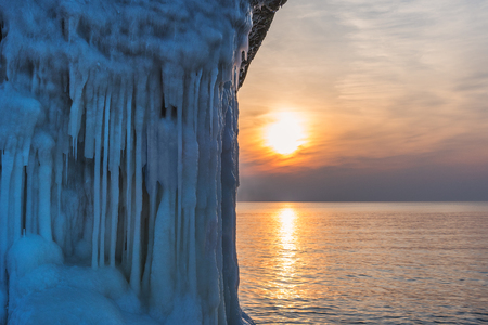 Ice on abandoned forifications at Baltic sea coast in winter evening, Liepaja, Latvia.の写真素材