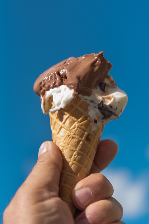 Ice cream in hand.の写真素材