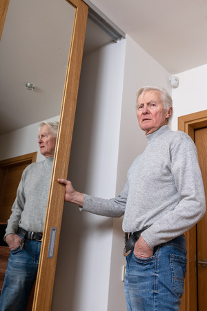 Senior at door.の写真素材