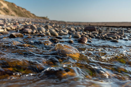Small creek on Baltic sea beach.の写真素材