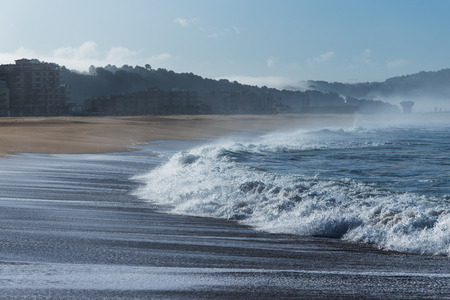 Atlantic wave on Nazare city beach, Portugal.の写真素材