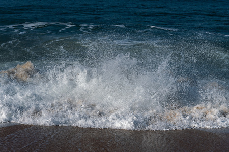 Splashing Atlantic ocean wave, Nazare, Portugal.の写真素材
