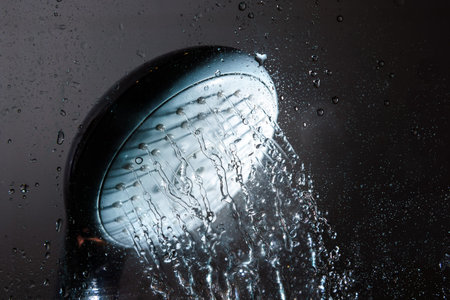 Shower head and falling water drops.