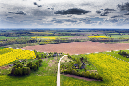 Fields and roads in latvian countryside.の写真素材