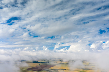 Cloudy and misty morning in latvian countryside.