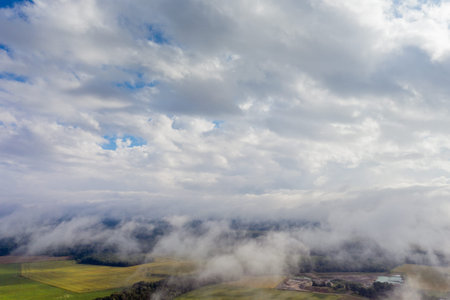 Cloudy and misty morning in latvian countryside.